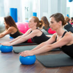 Aerobics pilates women with yoga balls