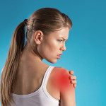 Young female patient having shoulder pain